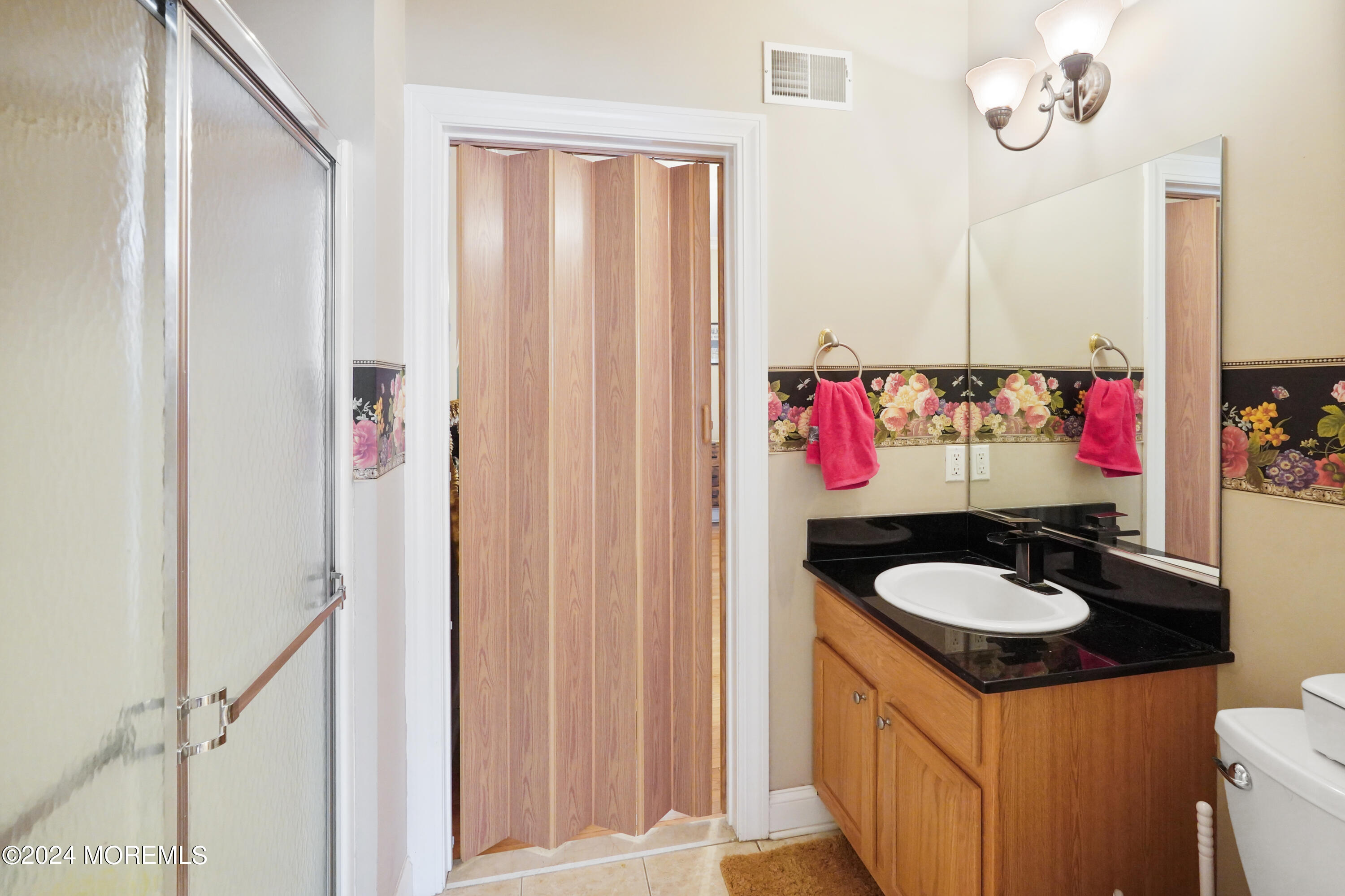 455 Iron Bridge Road Freehold, NJ 07728 - Photo 22 of 60 a bathroom with a sink and a mirror