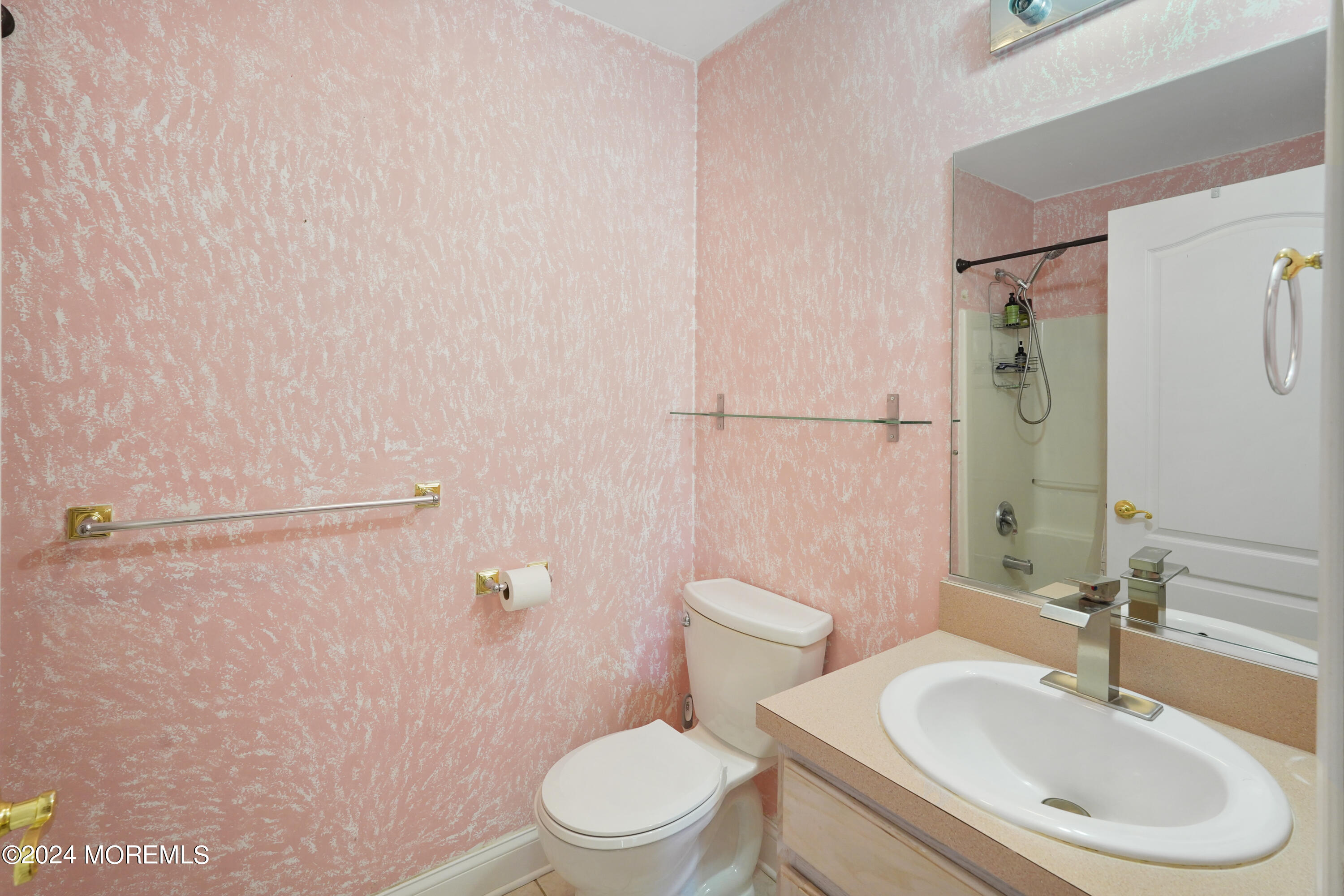 455 Iron Bridge Road Freehold, NJ 07728 - Photo 37 of 60 a white toilet sitting next to a bathroom sink