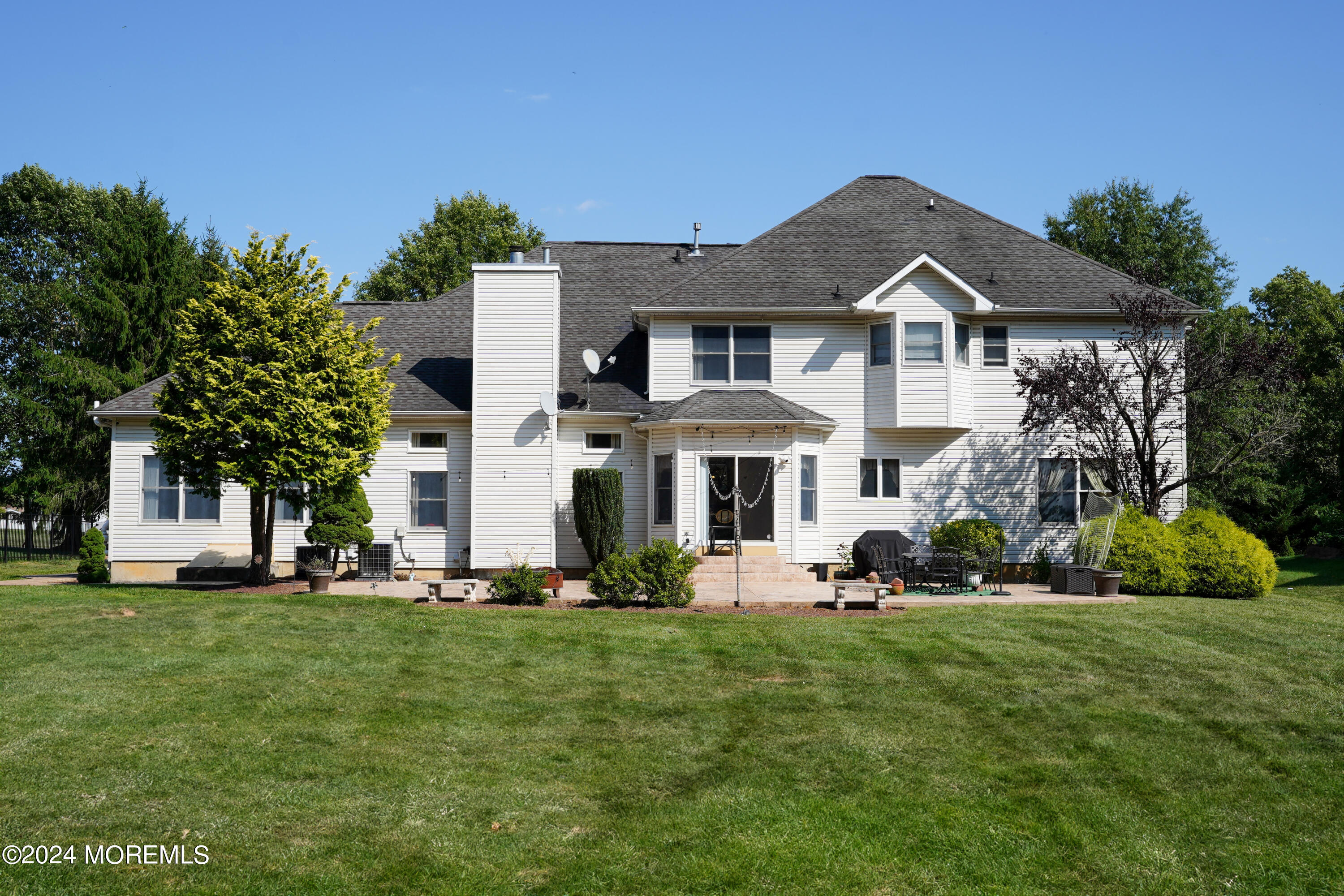 455 Iron Bridge Road Freehold, NJ 07728 - Photo 47 of 60 a front view of a house with a yard