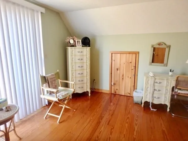 a view of a livingroom with furniture and windows