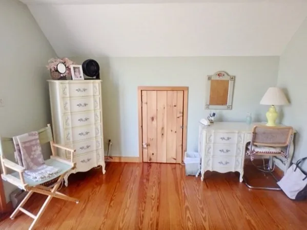 a room with furniture and wooden floor