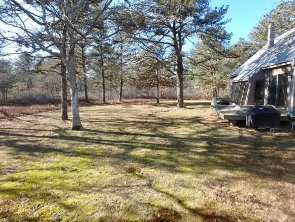 a swimming pool with trees in the background