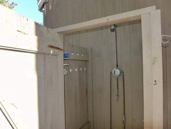 a bathroom with a shower and a glass door