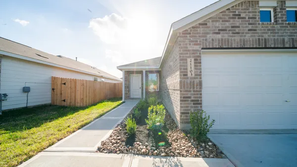 a house view with a backyard space