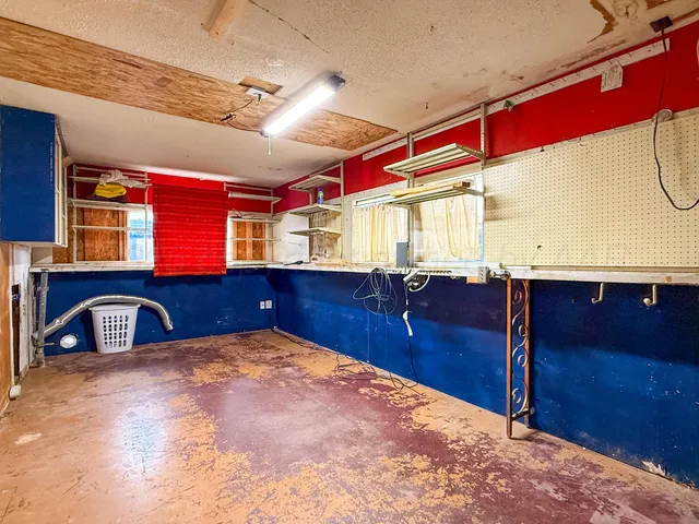 a front view of a house with a garden and deck