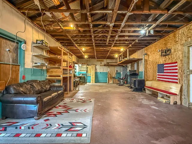 a view of an chairs and table in a room