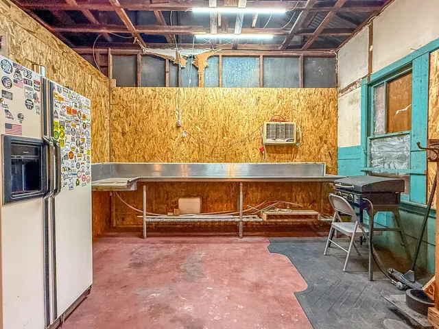 a view of a patio with table and chairs and potted plants