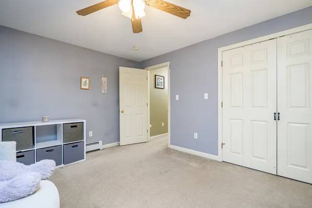 a bed room with a bed and a chandelier