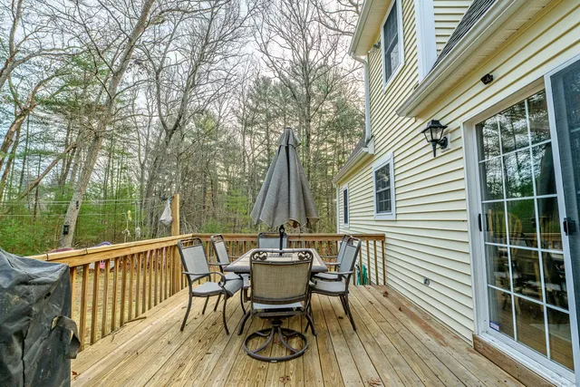 a view of a yard with large trees