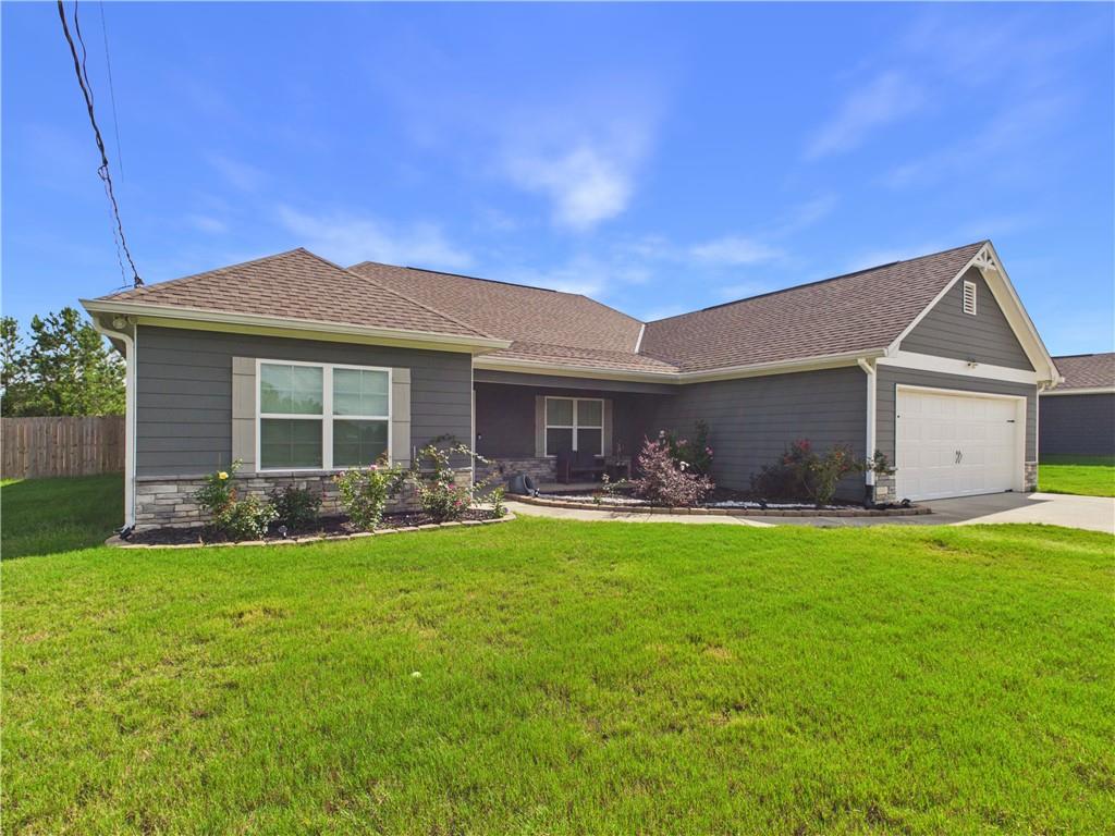 52 Owens Road Fort Mitchell, AL 36856 - Photo 2 of 29 Contemporary ranch-style exterior with dark gray siding and a stone accent facade