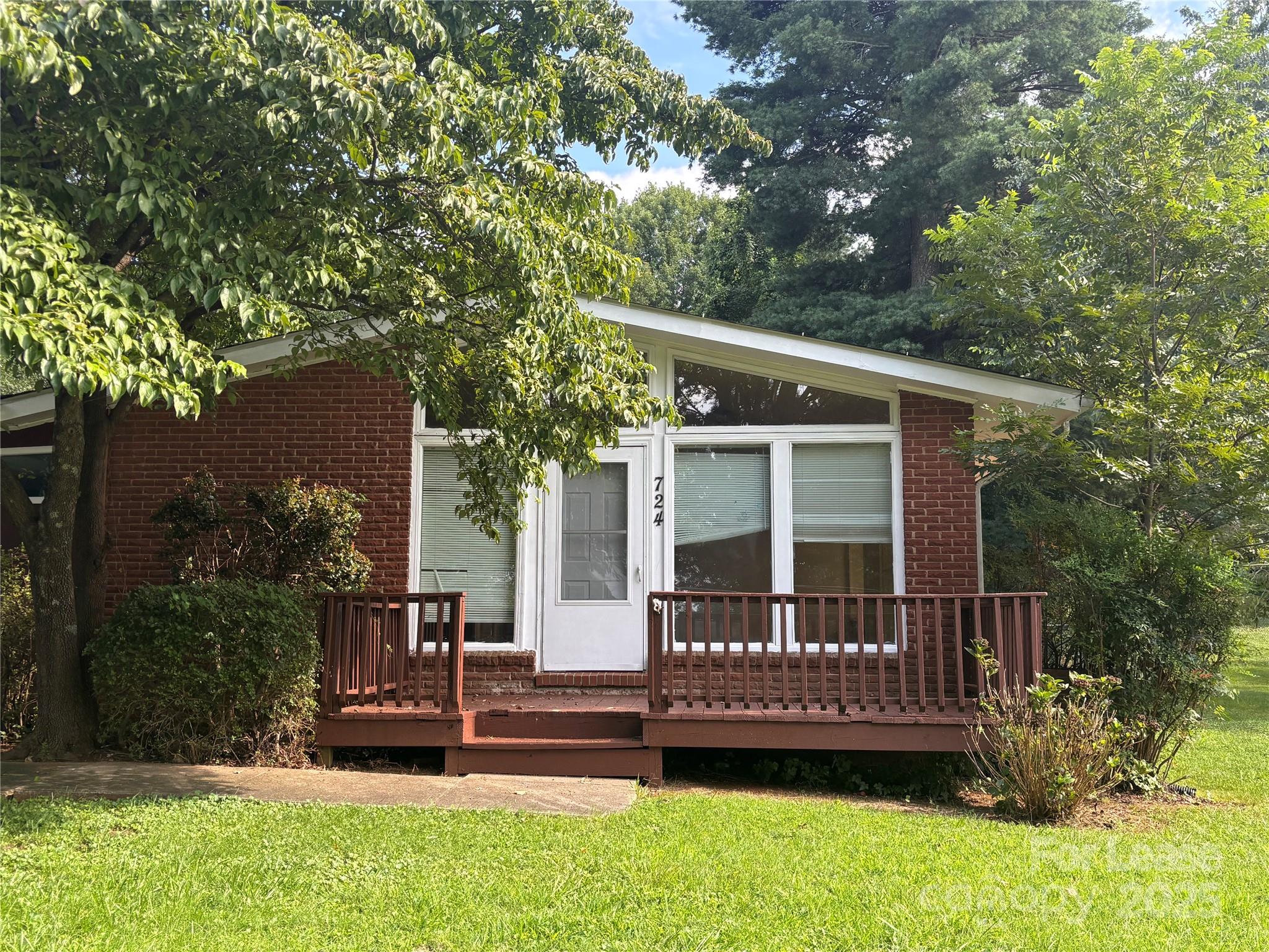 724 Oakdale Drive Statesville, NC 28677 - Photo 2 of 19 a view of house with a yard and sitting area