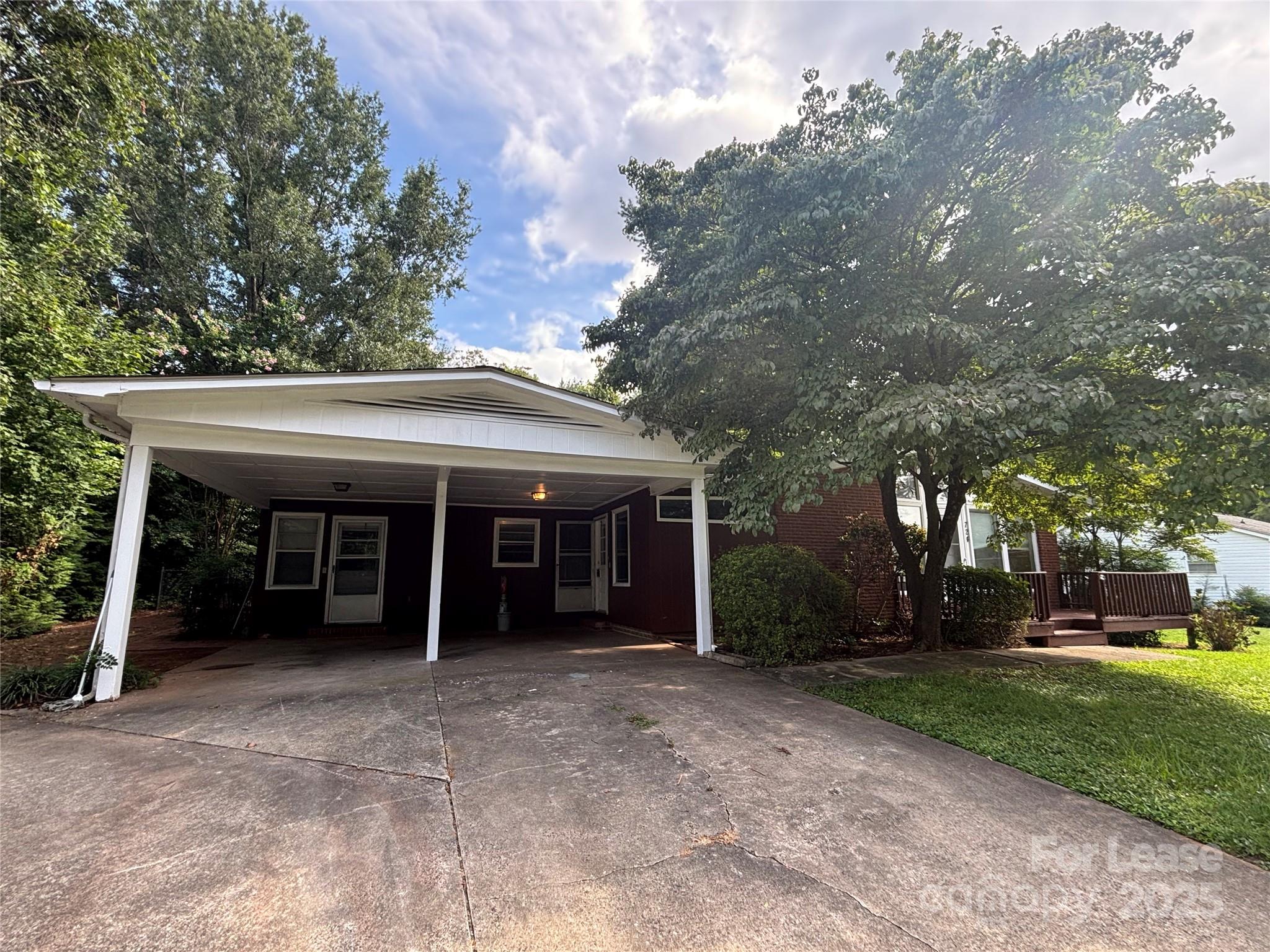 724 Oakdale Drive Statesville, NC 28677 - Photo 3 of 19 a view of a house with a yard and large tree