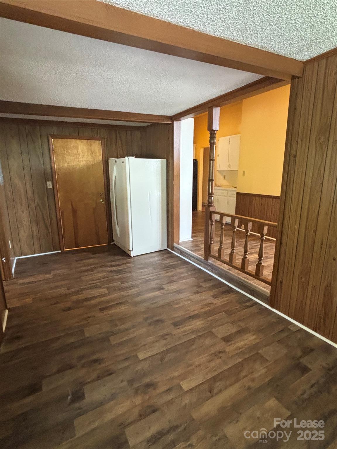 724 Oakdale Drive Statesville, NC 28677 - Photo 4 of 19 an empty room with wooden floor and windows