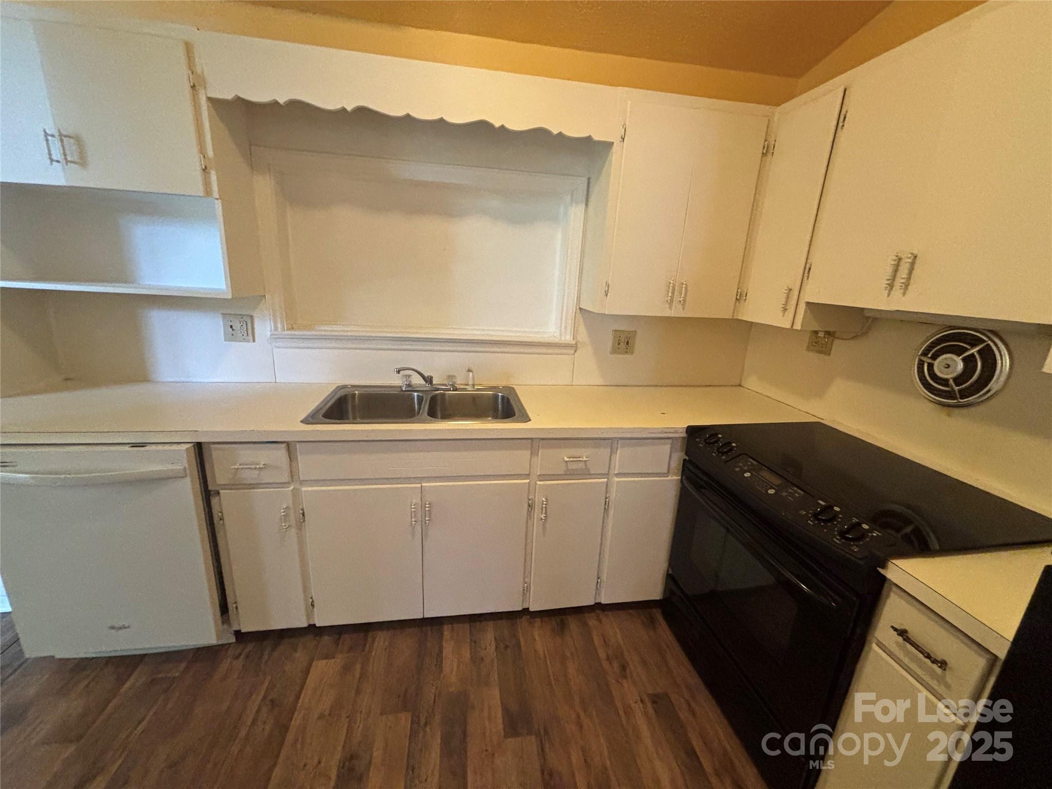 724 Oakdale Drive Statesville, NC 28677 - Photo 5 of 19 a kitchen with a sink a stove and cabinets