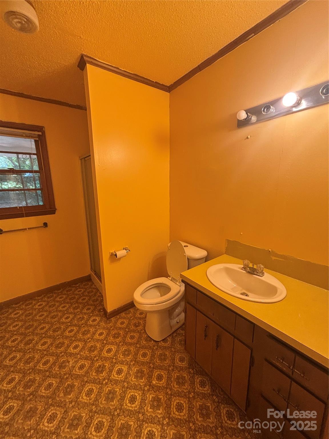 724 Oakdale Drive Statesville, NC 28677 - Photo 7 of 19 a bathroom with a granite countertop sink toilet and shower