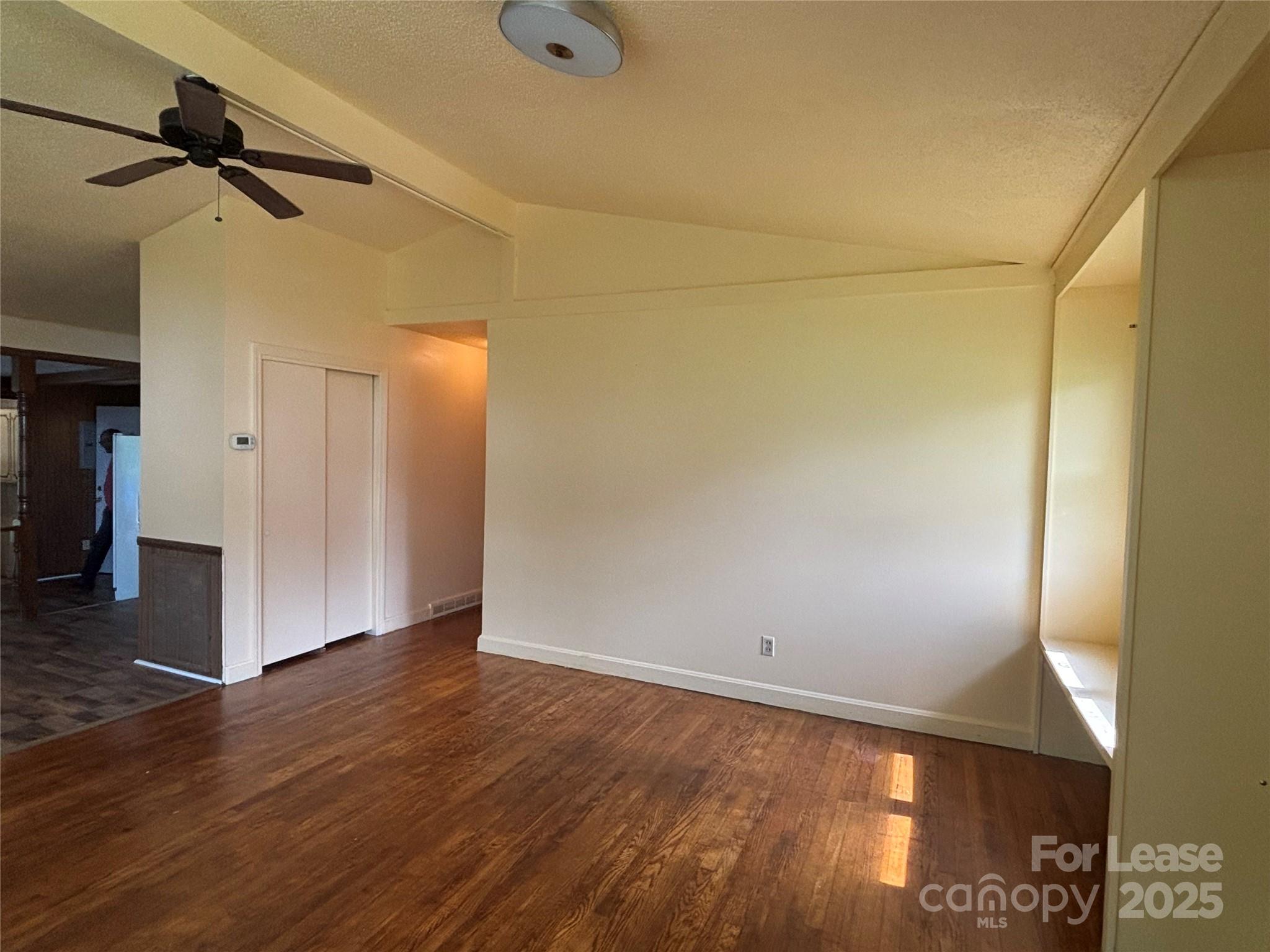 724 Oakdale Drive Statesville, NC 28677 - Photo 10 of 19 a view of empty room with wooden floor