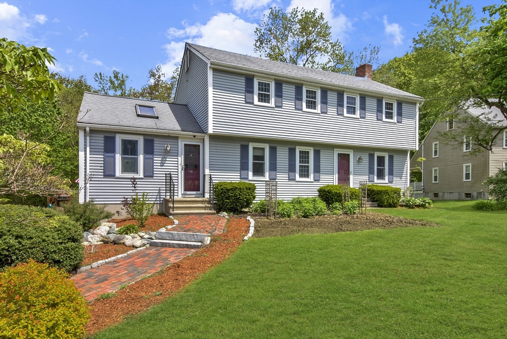 187 Eaton Road Framingham, MA 01701 - Photo 1 of 41 a front view of a house with yard and green space