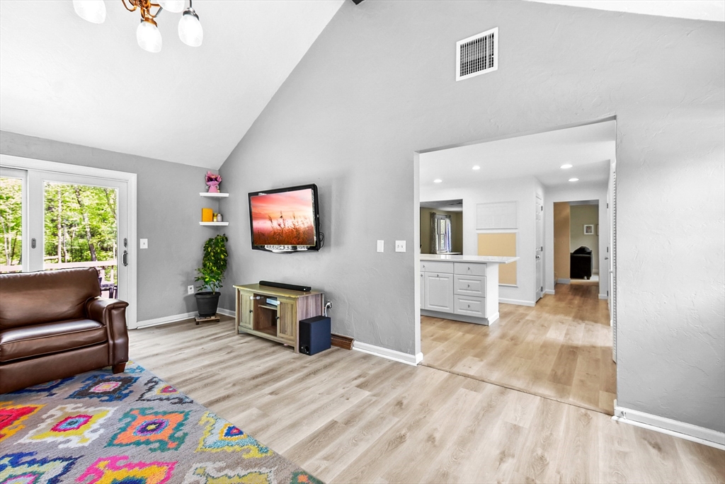 187 Eaton Road Framingham, MA 01701 - Photo 13 of 41 a living room with furniture and a flat screen tv