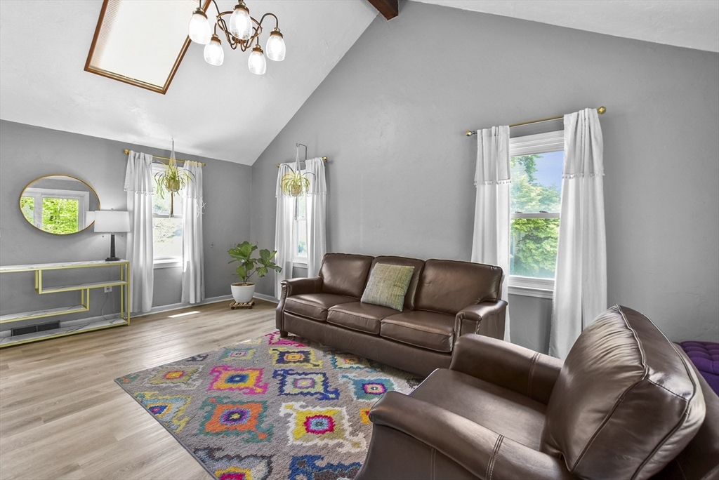 187 Eaton Road Framingham, MA 01701 - Photo 15 of 41 a living room with furniture and a wooden floor