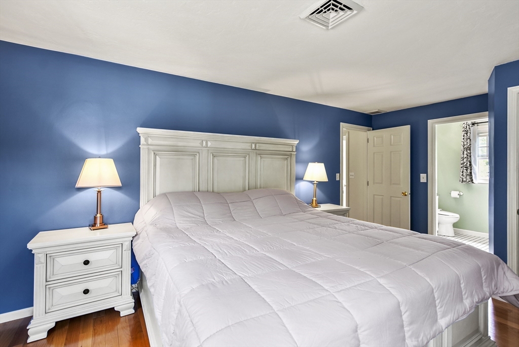 187 Eaton Road Framingham, MA 01701 - Photo 18 of 41 a bedroom with a bed and a lamp