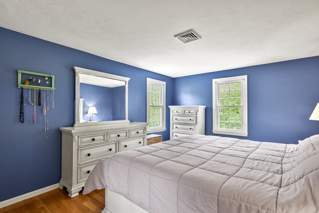 187 Eaton Road Framingham, MA 01701 - Photo 19 of 41 a bedroom with a large bed and a tv