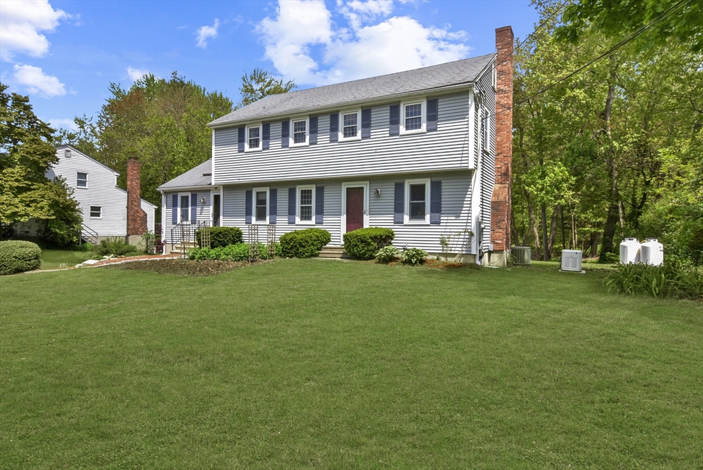 187 Eaton Road Framingham, MA 01701 - Photo 2 of 41 a front view of a house with a garden