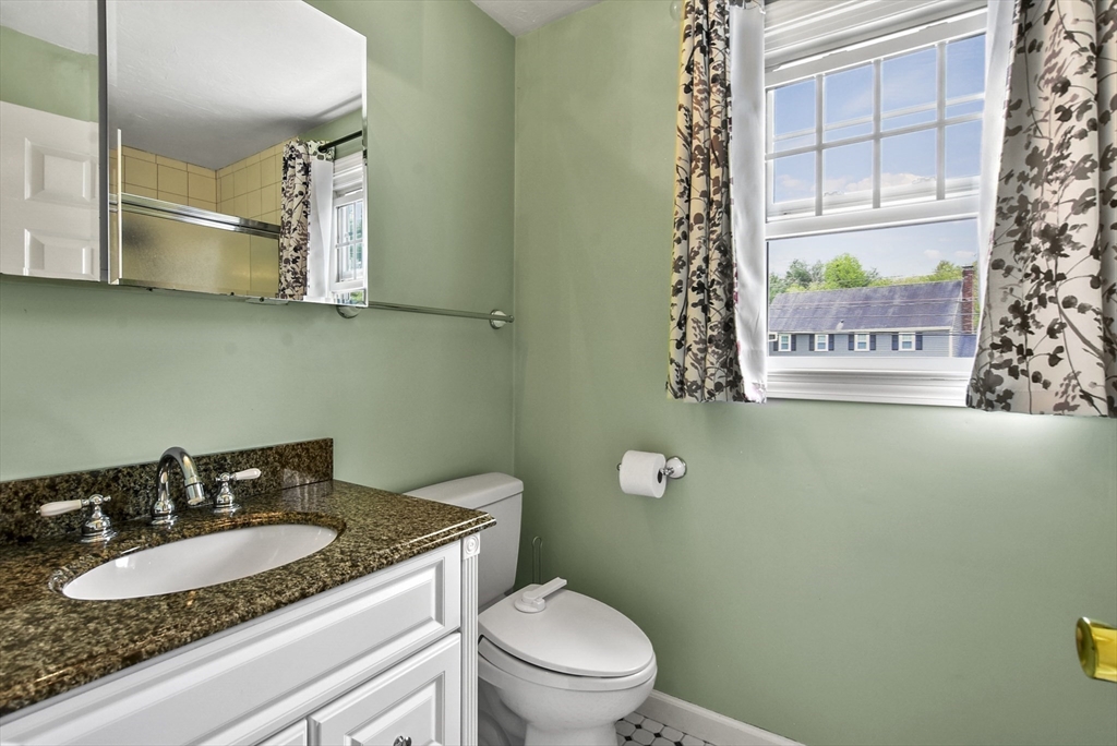 187 Eaton Road Framingham, MA 01701 - Photo 21 of 41 a bathroom with a granite countertop sink and a mirror