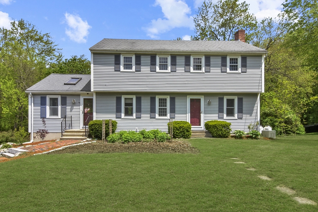 187 Eaton Road Framingham, MA 01701 - Photo 3 of 41 a front view of a house with a yard and porch