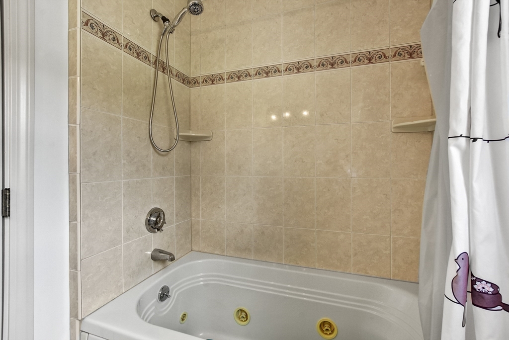 187 Eaton Road Framingham, MA 01701 - Photo 33 of 41 a bathroom with a bath tub with a shower