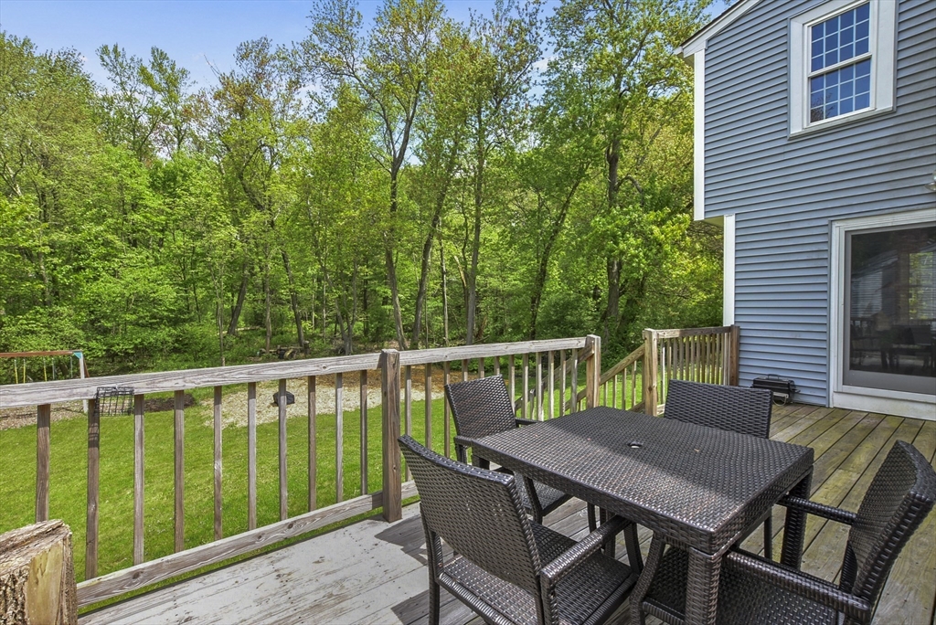 187 Eaton Road Framingham, MA 01701 - Photo 34 of 41 a view of a deck with a table and chairs