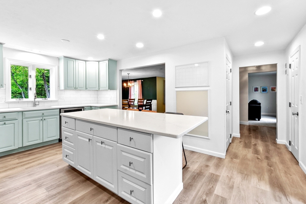 187 Eaton Road Framingham, MA 01701 - Photo 4 of 41 a kitchen with white cabinets and sink