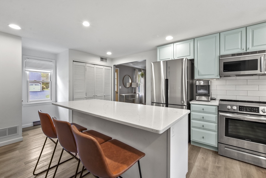 187 Eaton Road Framingham, MA 01701 - Photo 5 of 41 a large kitchen with a table and chairs