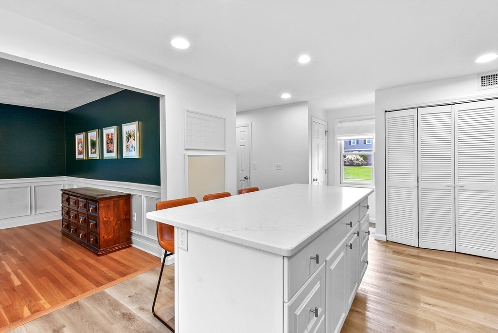 187 Eaton Road Framingham, MA 01701 - Photo 7 of 41 a living room with stainless steel appliances kitchen island granite countertop furniture and a kitchen view