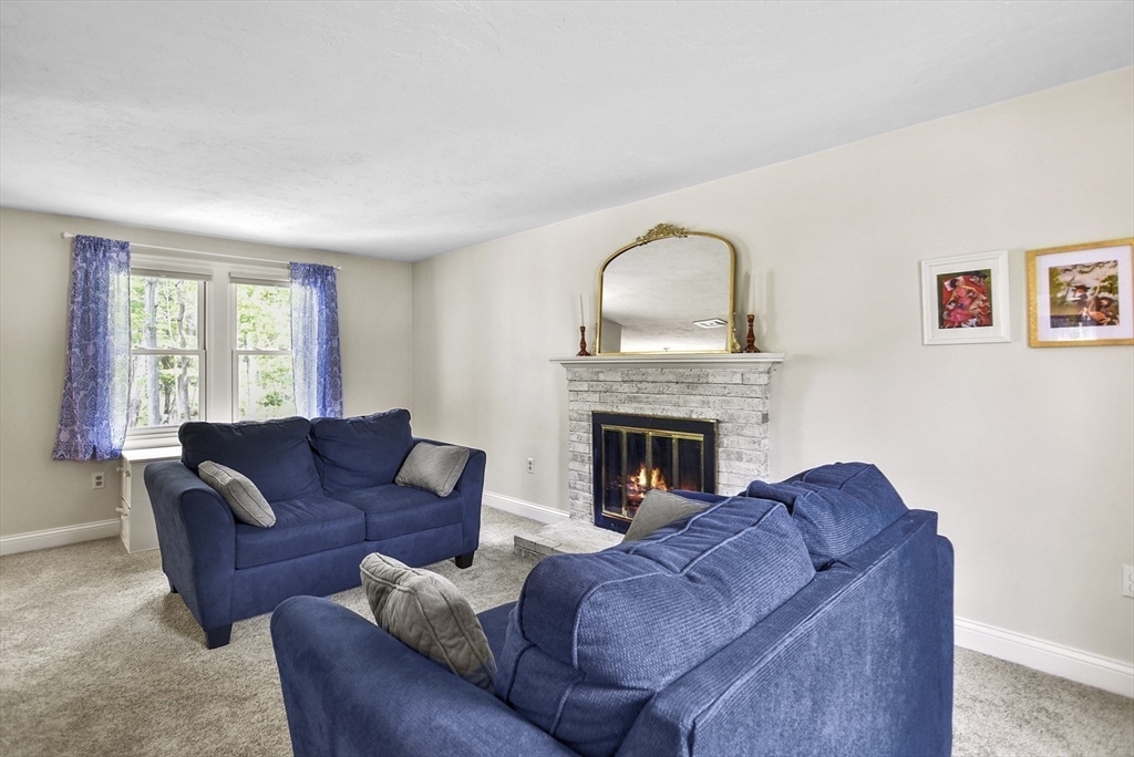 187 Eaton Road Framingham, MA 01701 - Photo 10 of 41 a living room with furniture and a fireplace