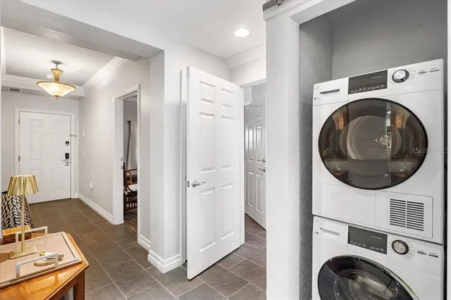 a kitchen with stainless steel appliances granite countertop a refrigerator stove and sink