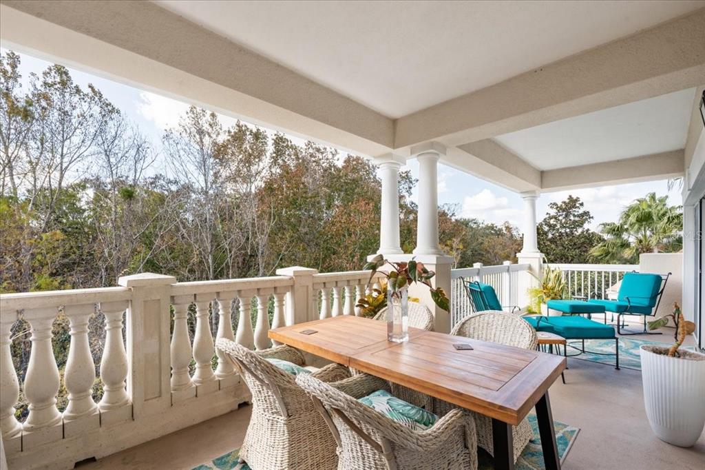 7658 Whisper Way, Unit 402 Reunion, FL 34747 - Photo 19 of 31 a view of an outside dining space with furniture window and outside view