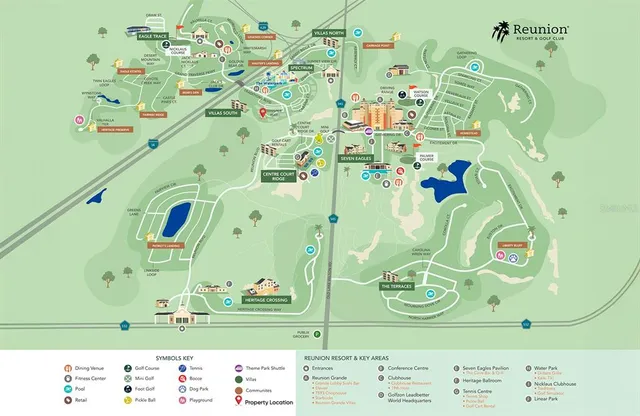 a kitchen with stainless steel appliances granite countertop a stove top oven a sink dishwasher a dining table and chairs with wooden floor