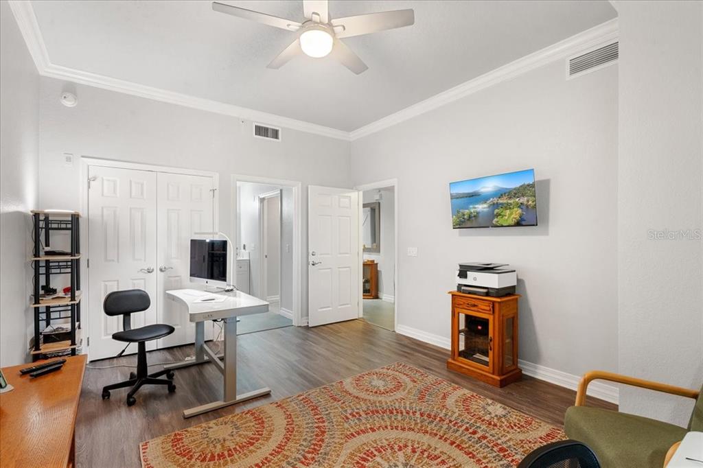 7658 Whisper Way, Unit 402 Reunion, FL 34747 - Photo 21 of 31 a view of a livingroom with workspace and a window