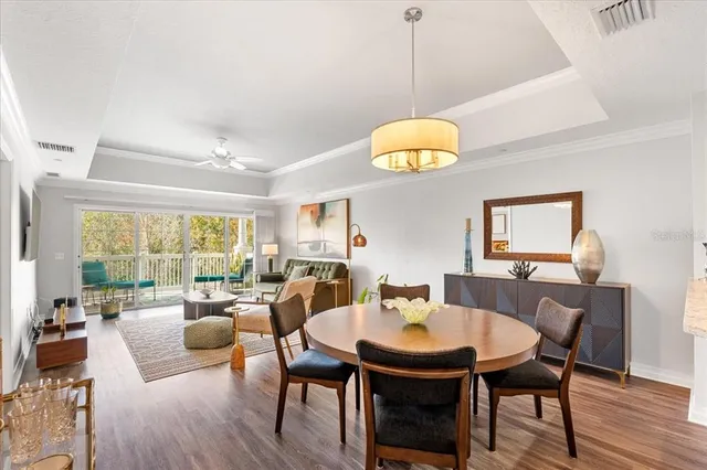 a view of a dining room with furniture a livingroom and furniture