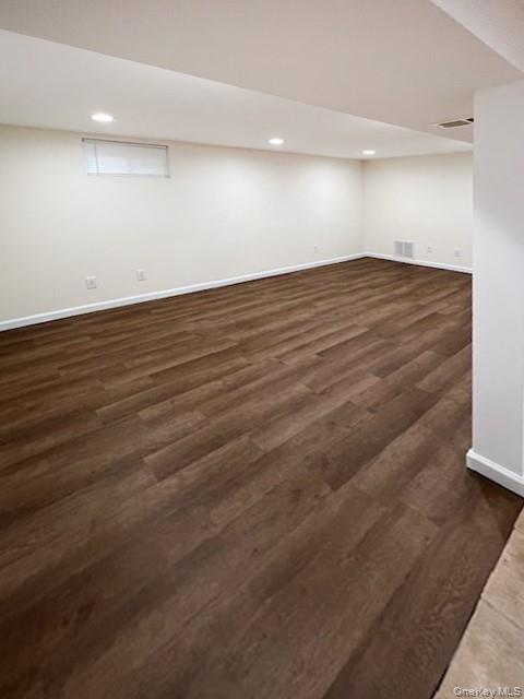 122 Miller Road Hicksville, NY 11801 - Photo 23 of 27 Finished below grade area with recessed lighting and dark wood-style flooring
