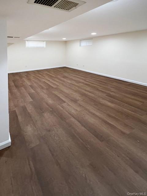 122 Miller Road Hicksville, NY 11801 - Photo 24 of 27 Basement featuring baseboards and dark wood finished floors