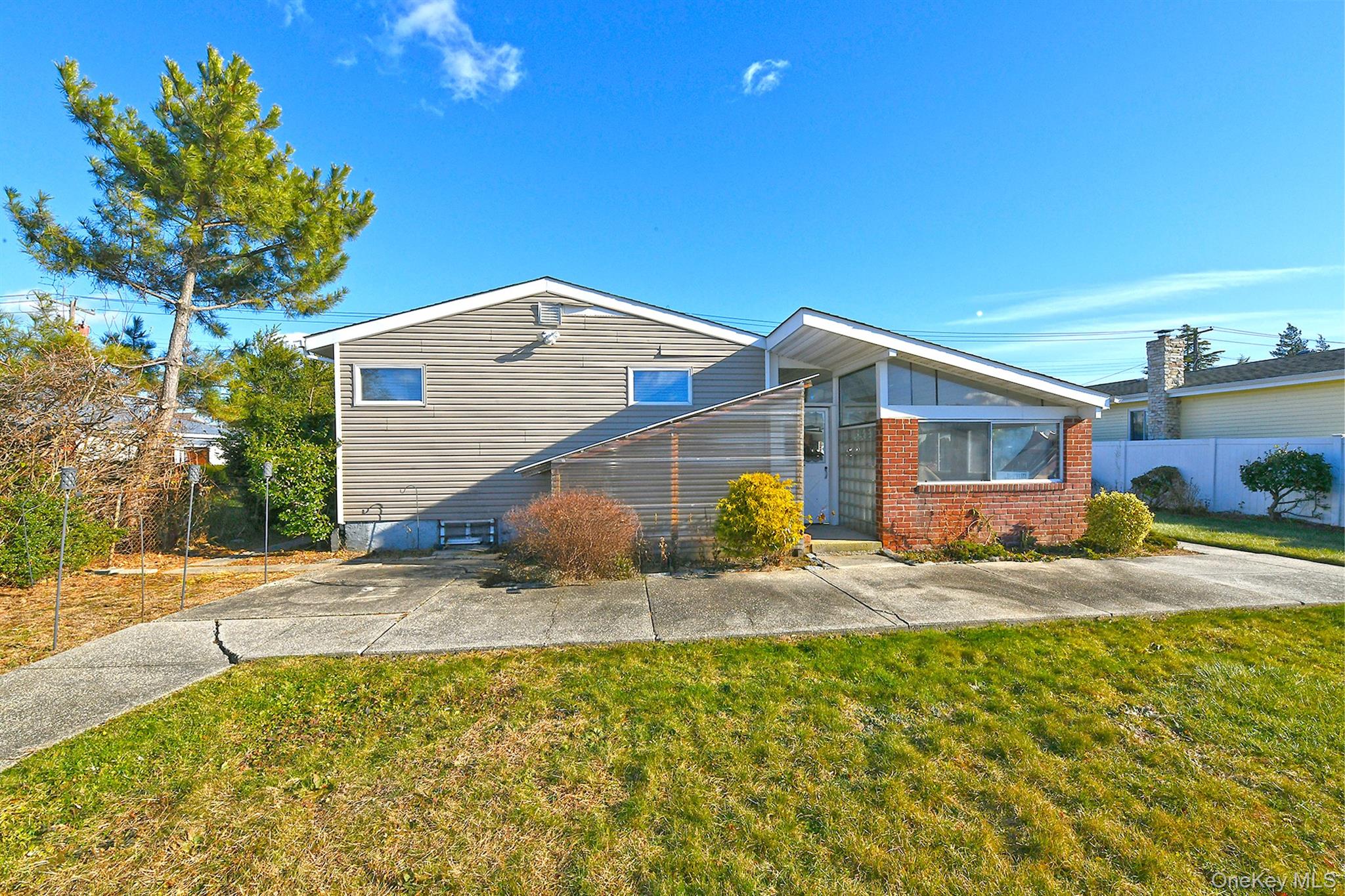 122 Miller Road Hicksville, NY 11801 - Photo 26 of 27 View of front of home with brick siding