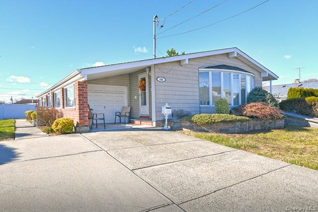 122 Miller Road Hicksville, NY 11801 - Photo 3 of 27 View of front of home featuring concrete driveway and brick siding