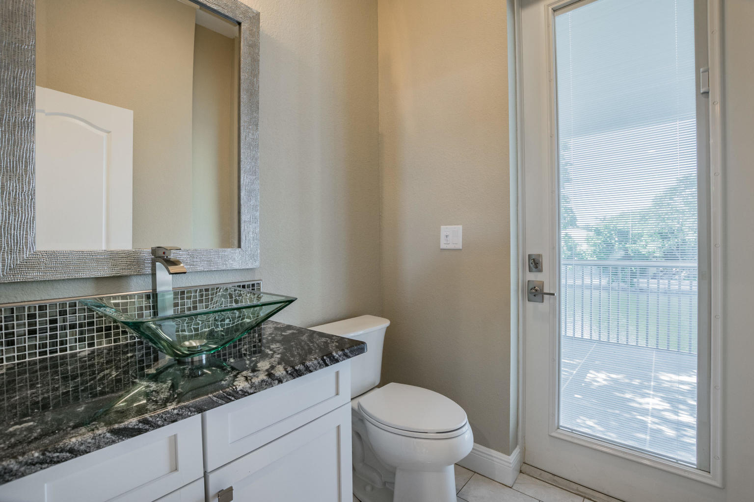 2 Go Lane Key West, FL 33040 - Photo 13 of 42 a bathroom with a granite countertop sink and a mirror