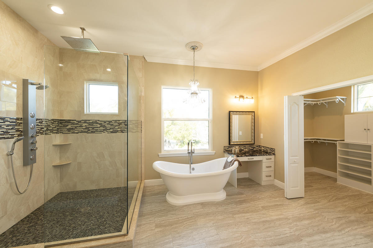 2 Go Lane Key West, FL 33040 - Photo 15 of 42 a spacious bathroom with a double vanity sink a mirror and a bathtub