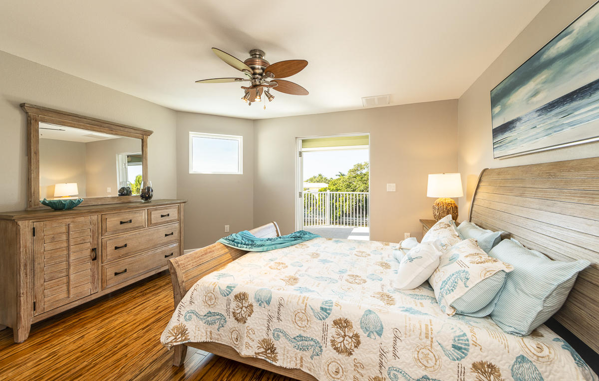 2 Go Lane Key West, FL 33040 - Photo 20 of 42 a bedroom with a bed and a dresser
