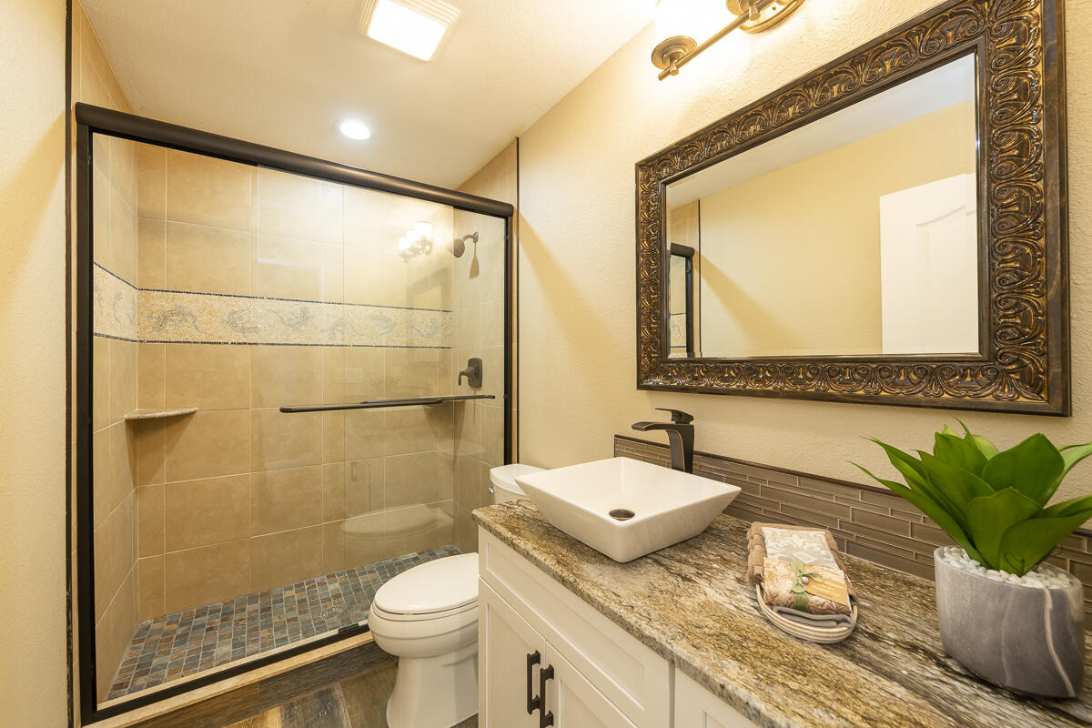 2 Go Lane Key West, FL 33040 - Photo 21 of 42 a bathroom with a granite countertop sink and a mirror