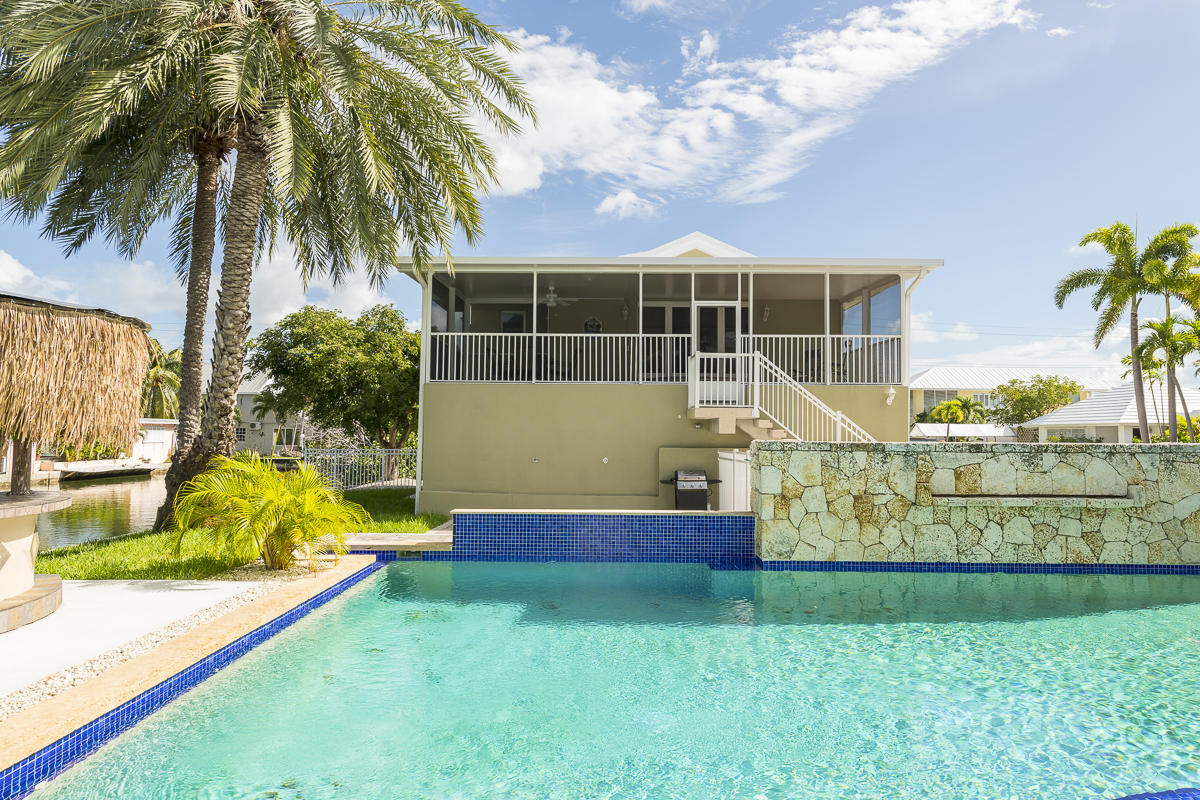 2 Go Lane Key West, FL 33040 - Photo 4 of 42 a front view of a house with garden