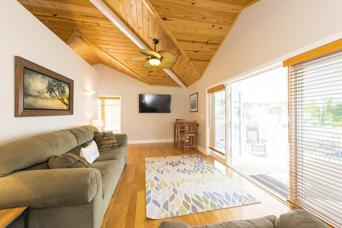2 Go Lane Key West, FL 33040 - Photo 32 of 42 a living room with furniture and a flat screen tv