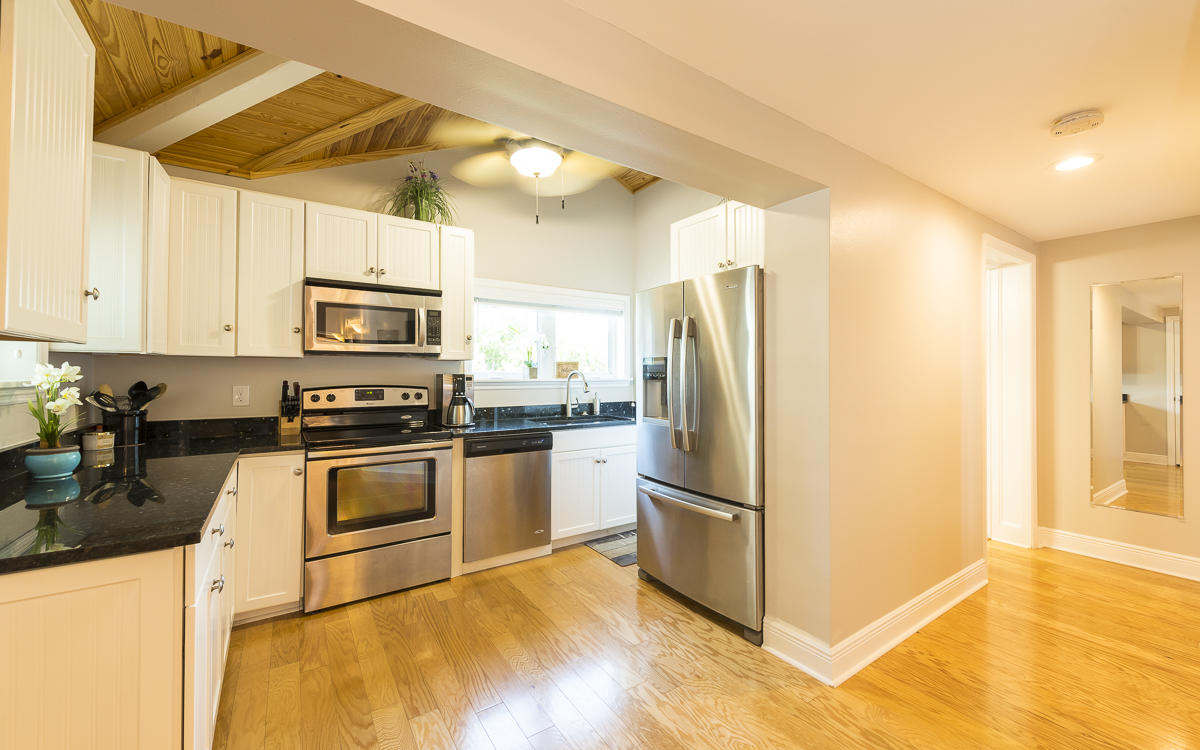 2 Go Lane Key West, FL 33040 - Photo 33 of 42 a kitchen with granite countertop a refrigerator and a stove top oven
